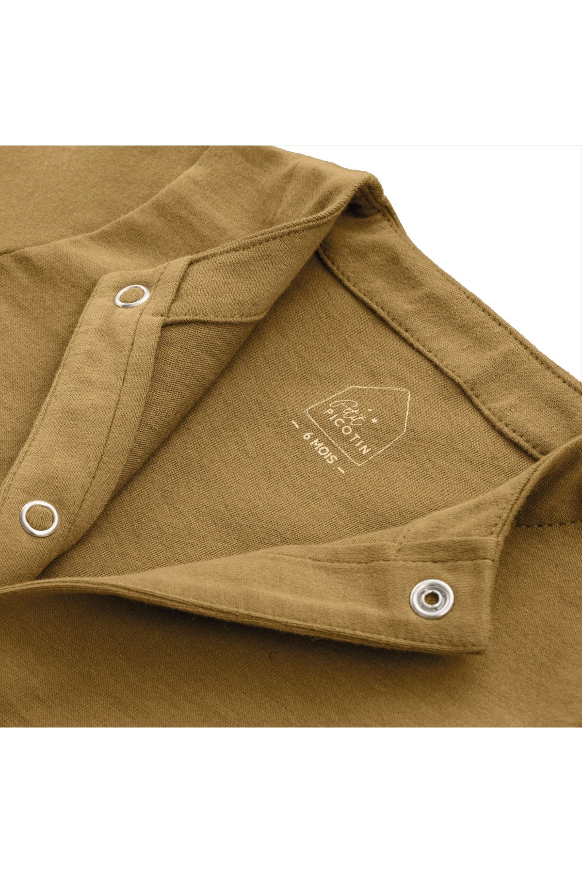 bonito pijama liso en jersey de algodón orgánico para bebé con botones de presión