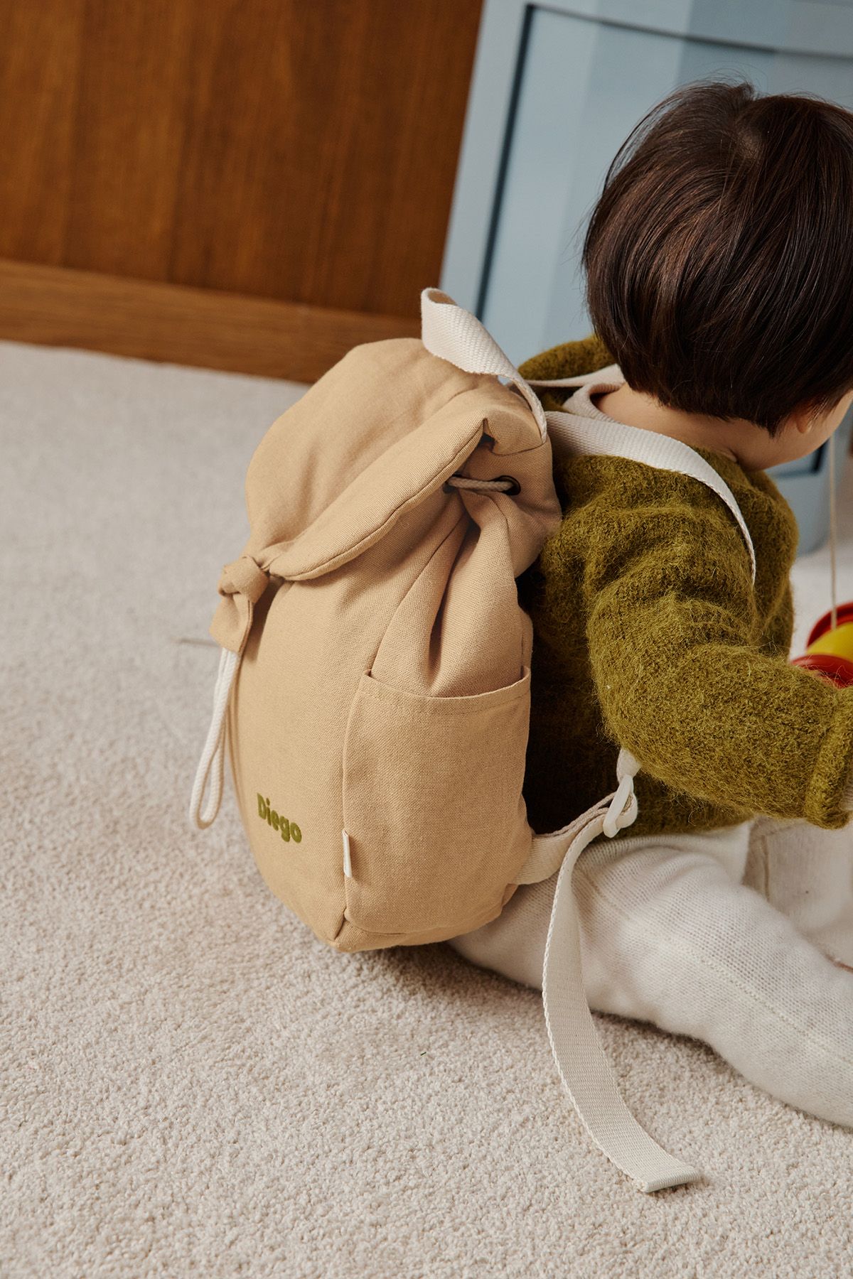 mochila bebé de lino personalizable con asas ajustables