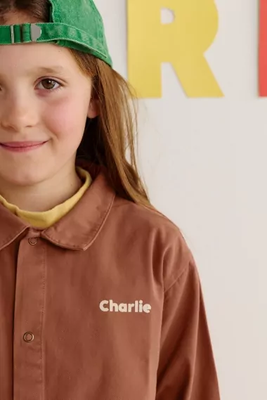 blouse d'école en coton bio personnalisable avec pression